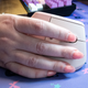 A photo of a person using a Logitech Lift mouse